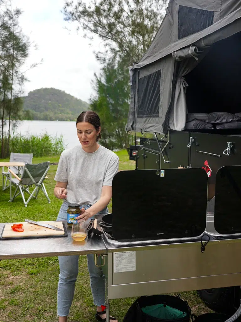 Nic opening a jar, preparing to use its contents.