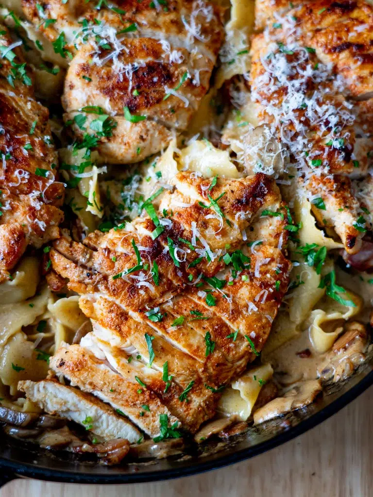 Close-up top view of Chicken Boscaiola Pasta in a pan.