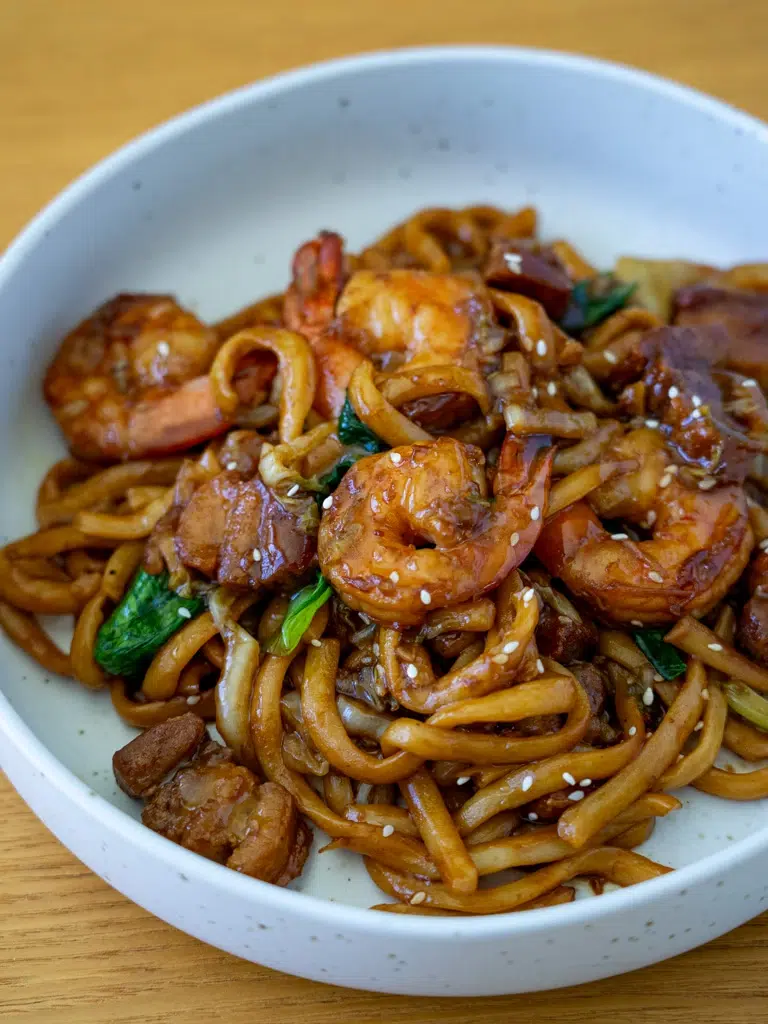 Overhead angled view of Malaysian-inspired Hokkien Mee served on a plate