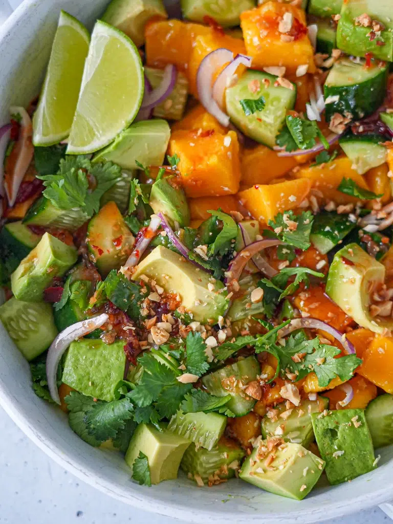 Close-up of Mango Salad with Sweet Chilli Lime Dressing in a bowl.