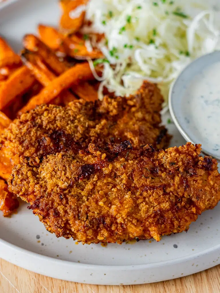 Close-up of crispy Southern-style baked chicken strips, golden brown and freshly cooked.